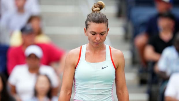 Simona Halep reacts during a match against Daria Snigur on Day 1 of the 2022 U.S. Open.